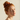 Day + Night Silk Scrunchie in Auburn reduces friction to prevent breakage, worn by a model with red hair.