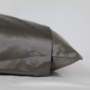 ZILK logo embroidered on dark gray silk pillowcase