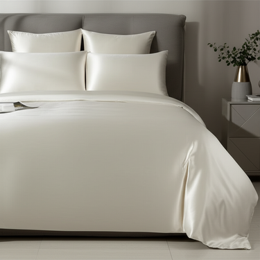 ZILK silk pillowcases styled on bed in ivory
