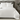 ZILK silk pillowcases styled on bed in white