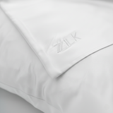 ZILK embroidered logo on White silk fabric